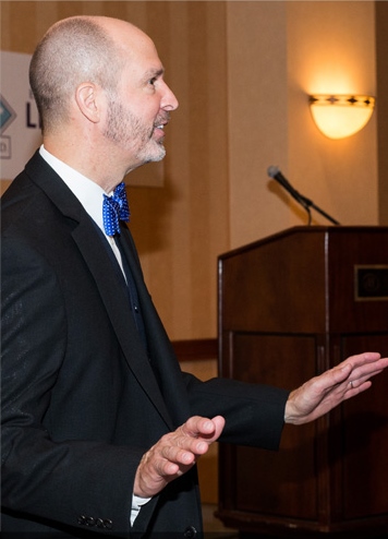 Eric Benson, speaking before a live audience.